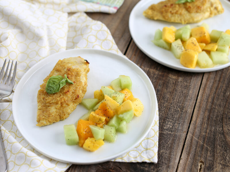 chicken and melon on white plate