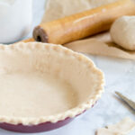 gluten free pie crust on marble with knife