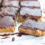 almond coconut bars topped with chocolate