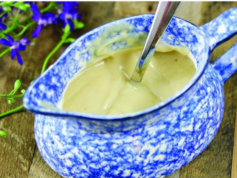 Cauliflower gravy in a decorative white and blue gravy boat