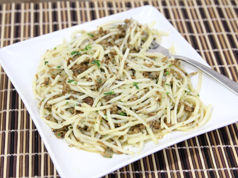 heart of palm linguini with clam sauce on white plate