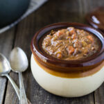 Hearty Beef Stew in old-fashioned soup bowl with handle.