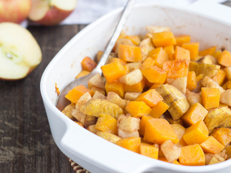 Cinnamon Butternut Squash with Plantain and Apple in a square white casserole dish.