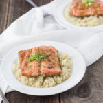 Teriyaki-Inspired Poached Salmon served over cauliflower rice in a white bowl.