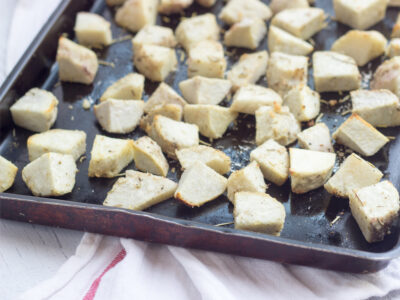 Savory Roasted Taro extra-large diced on a seasoned sheet pan.