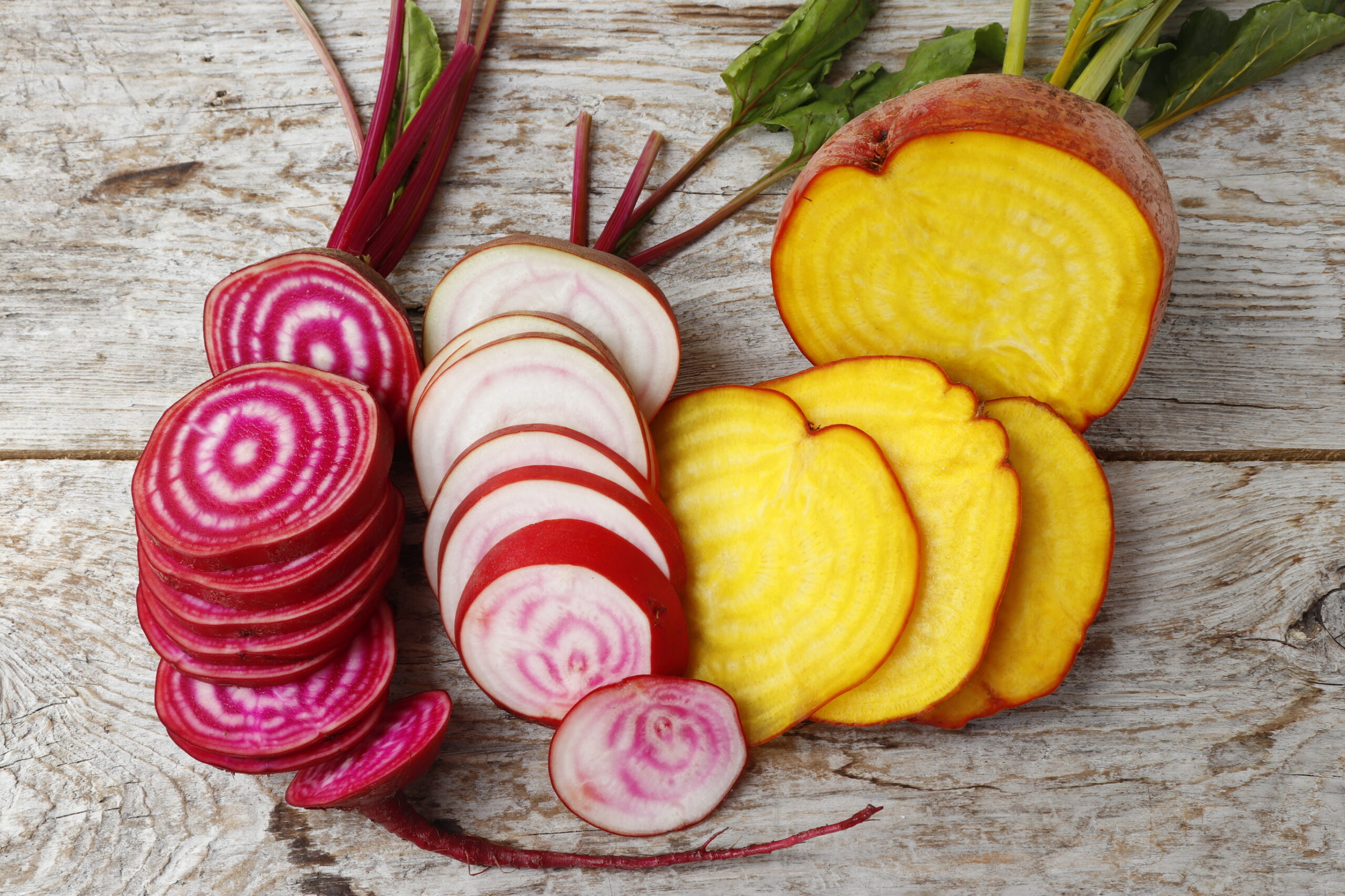 An image of several varieties of beets.