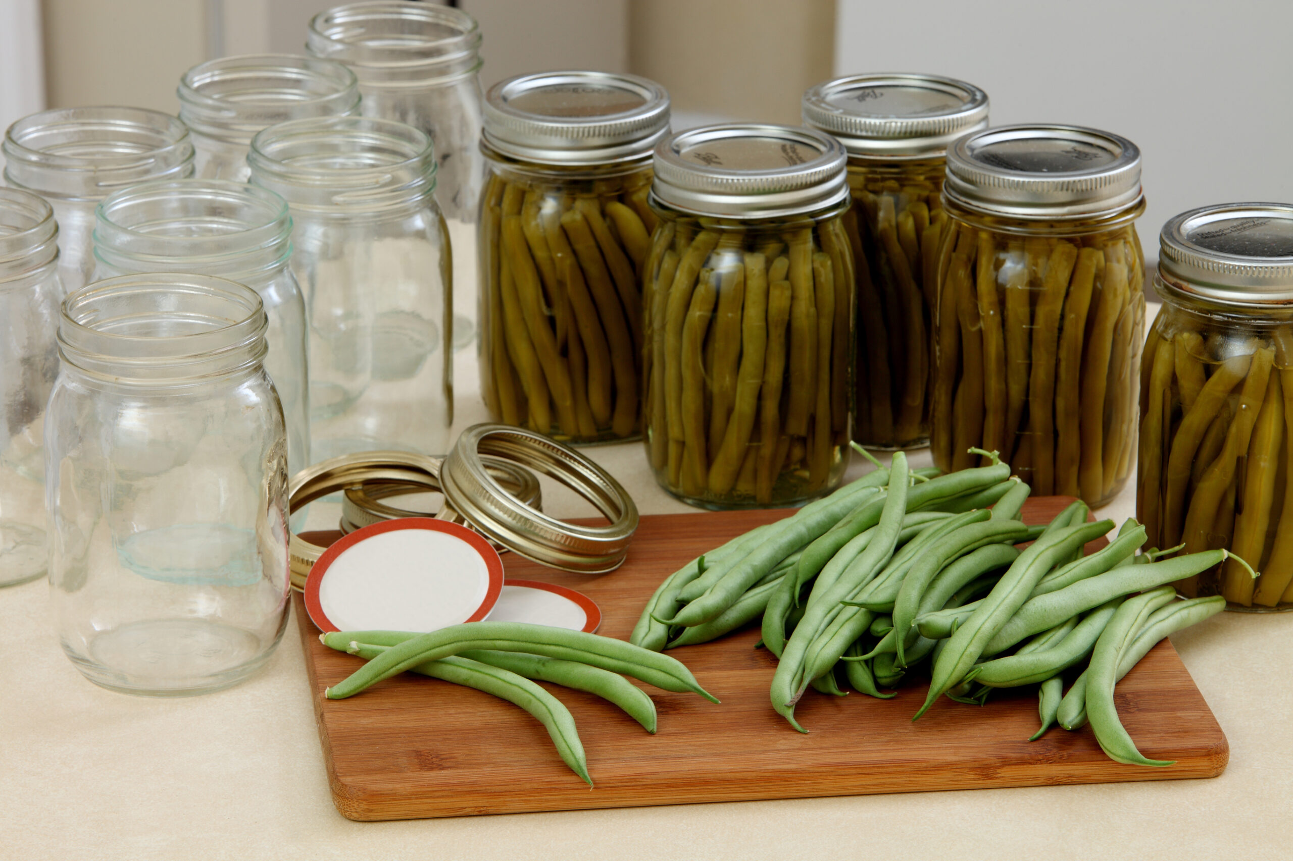 An image of green beans being canned at home.