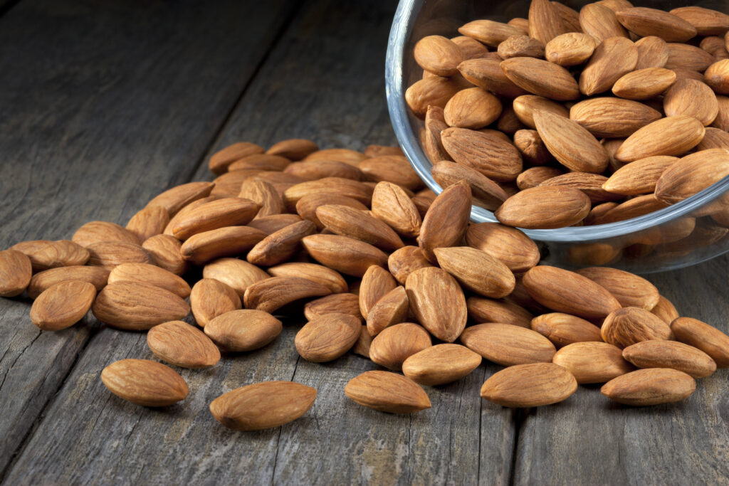 An image of almonds on a table.