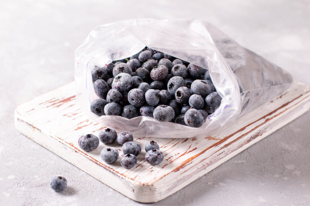 An image of frozen blueberries in a freezer bag.