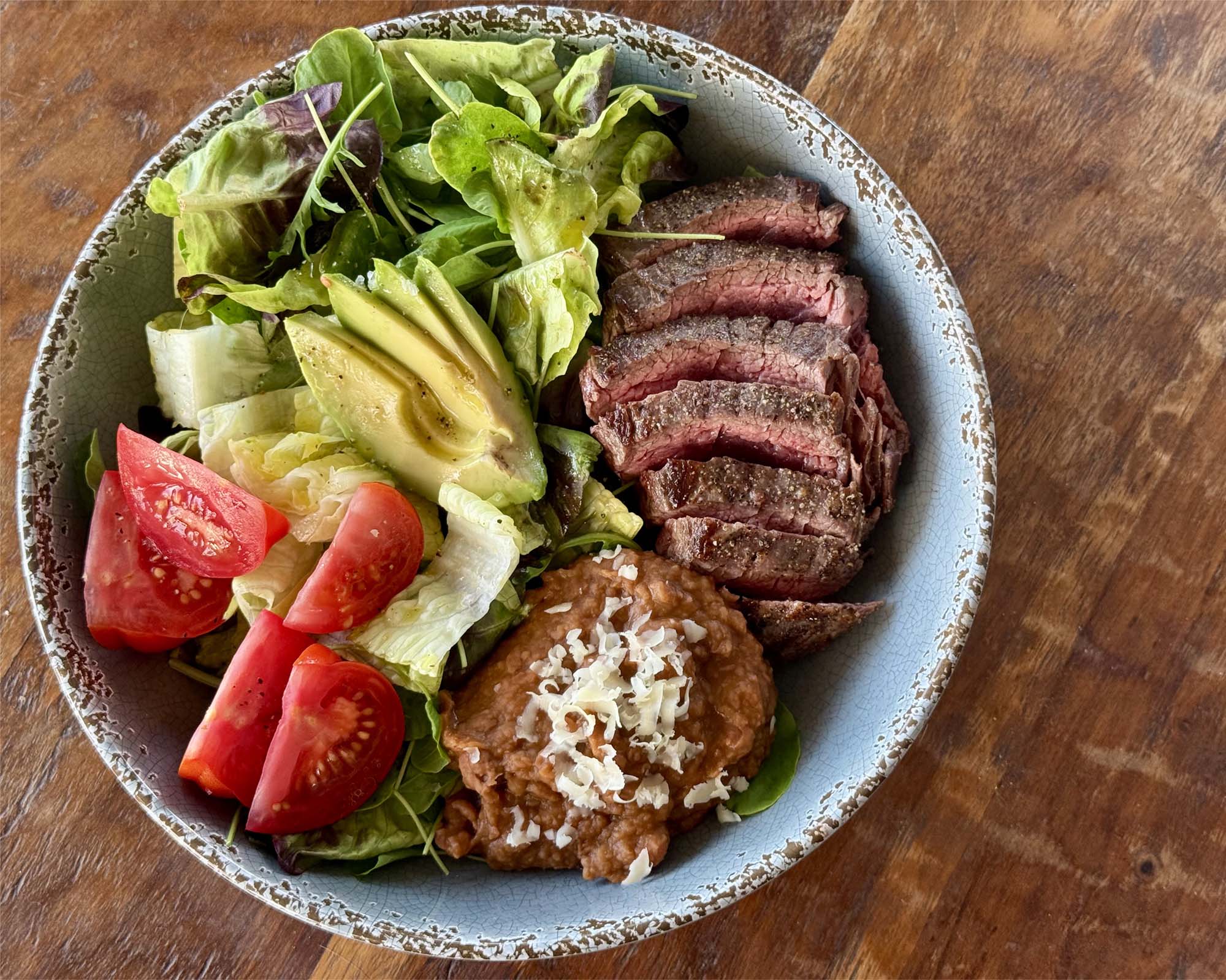 Steak Salad Bowl with Refried Beans and Lime Vinaigrette