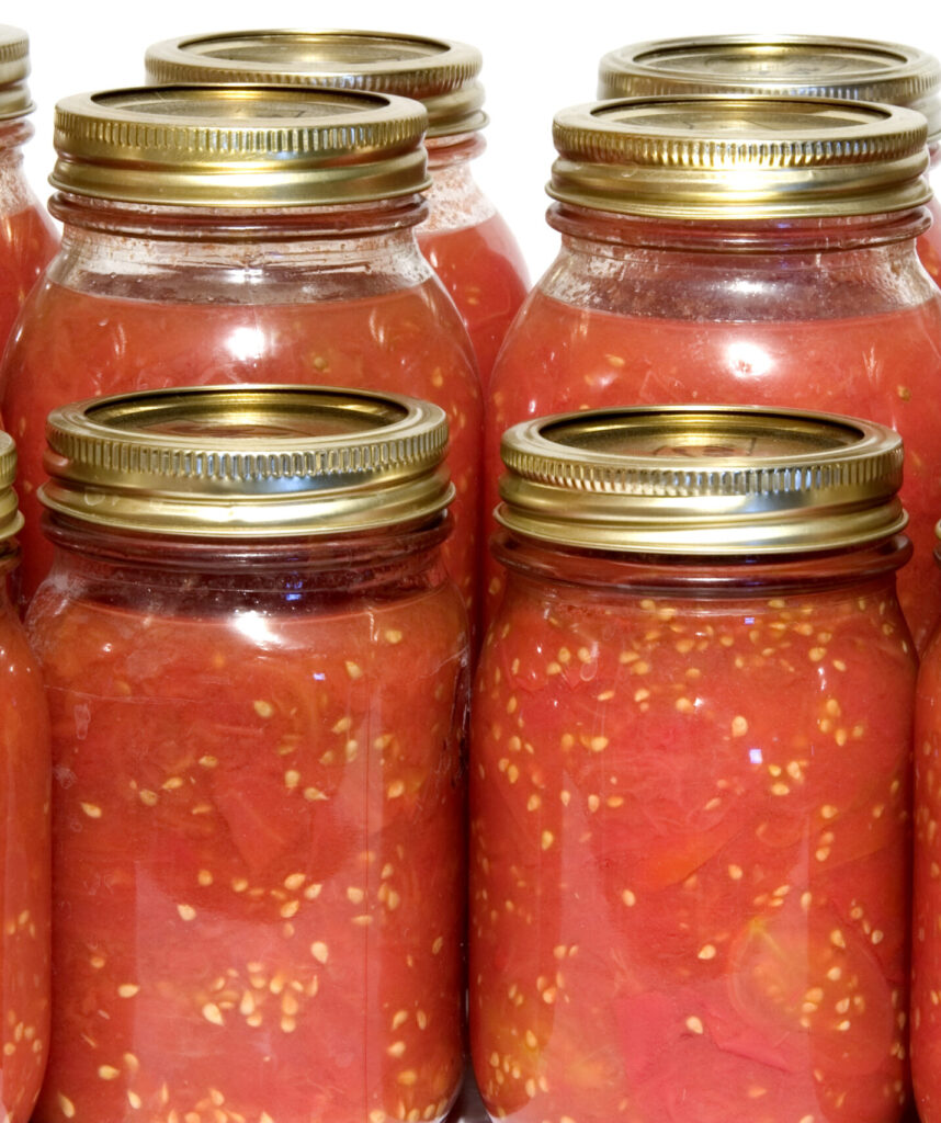 An image of home preserved tomatoes.