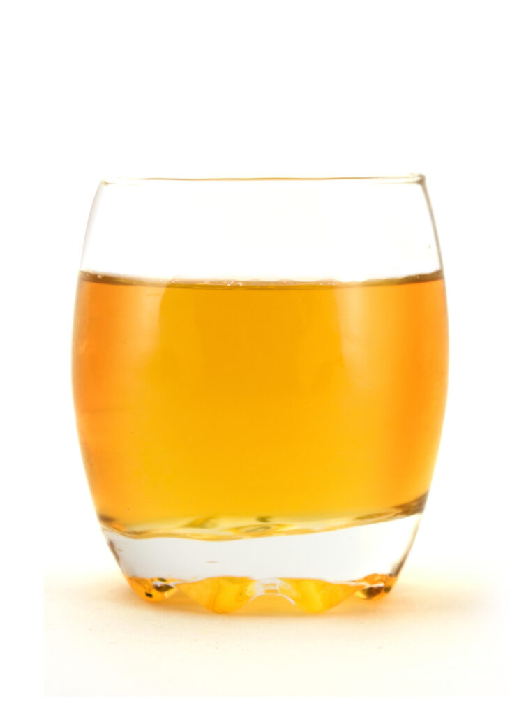 An image of a glass of apple juice.