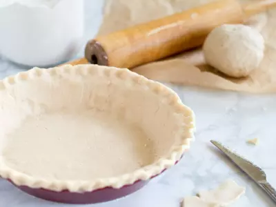 gluten free pie crust on marble with knife