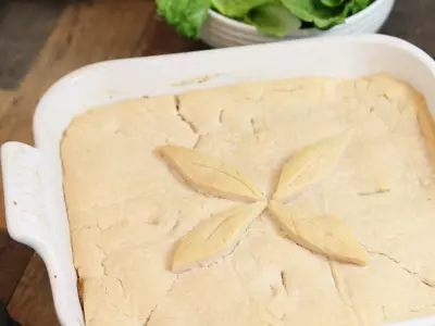 salmon tourtiere in white square dish