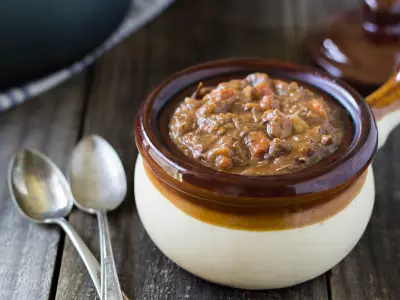 Hearty Beef Stew in old-fashioned soup bowl with handle.