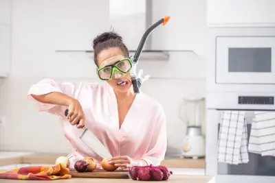 An image of a person protecting their eyes when cutting onions.
