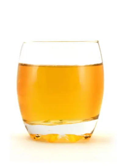 An image of a glass of apple juice.